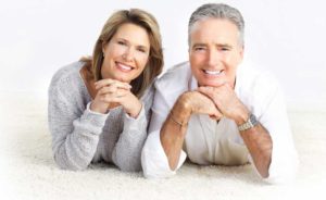 Happy-Couple-with-New-Carpets-at-Home-2